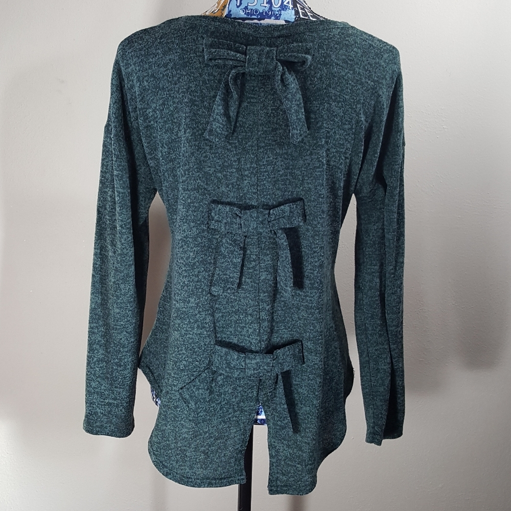 Green long sleeve shirt with bows down the back